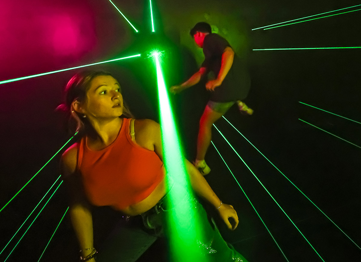 Players dodging lasers at Activate